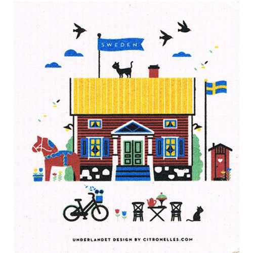 Red stuga dishcloth with yellow roof, Swedish flag, black cat, and dala horse.