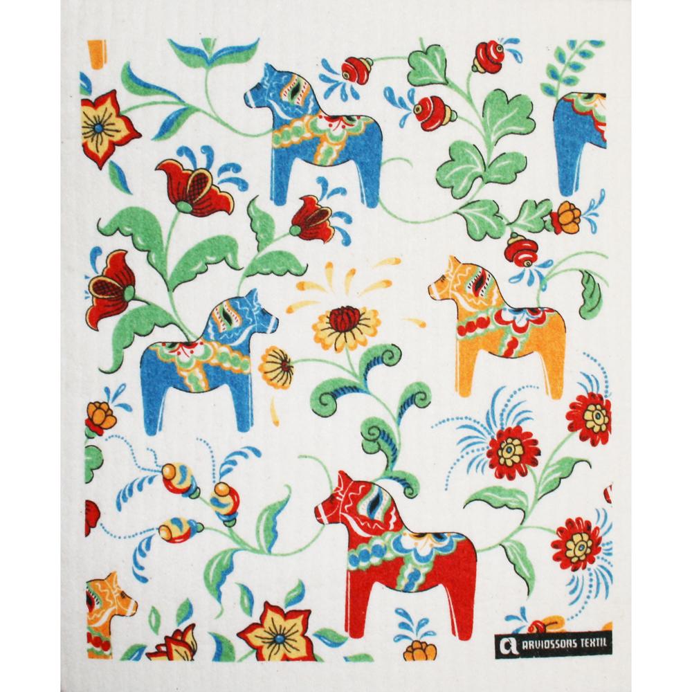 White Swedish dishcloth with colorful Dalahorses and Kurbits floral pattern.